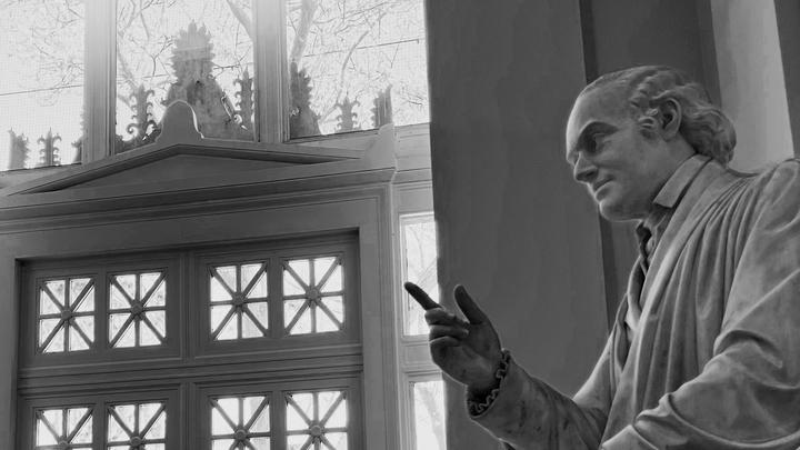 statue of Joseph Story pointing his finger, as if lecturing